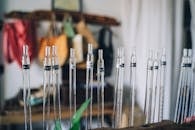 Glass tubes arranged in a laboratory setting, showcasing scientific equipment.